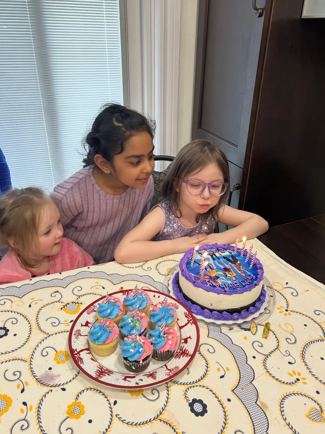 Photo of daycare kids celebrating a birthday with cake